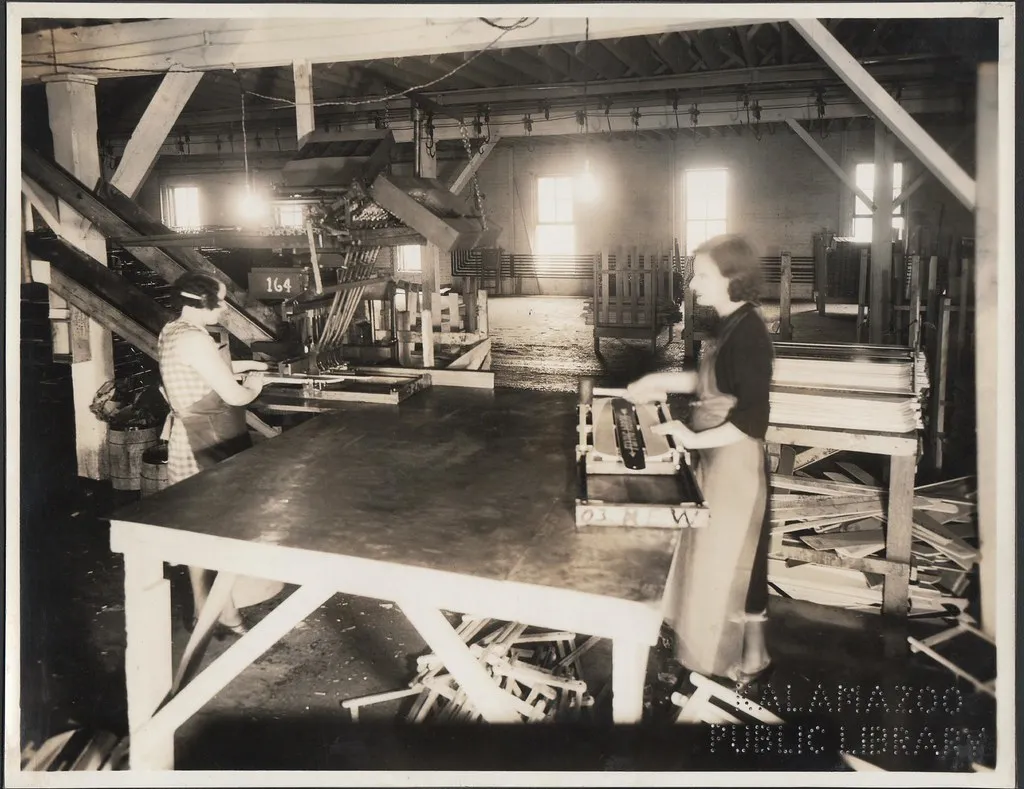 Workers on a historic factory assembly line