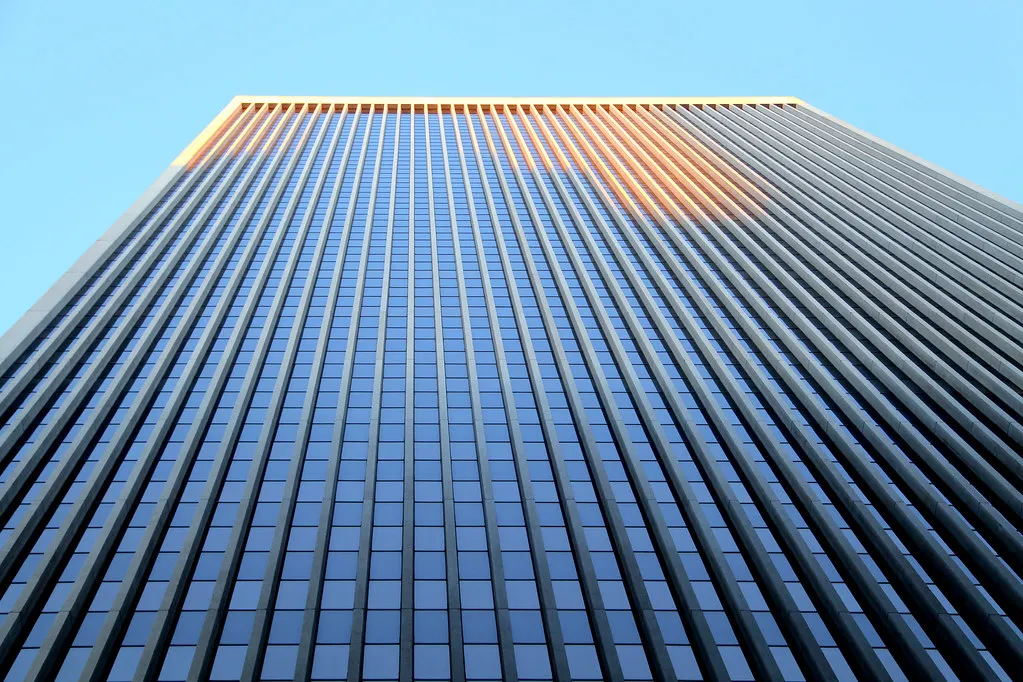 A corporate office skyscraper photographed from below