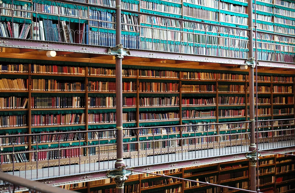 Towering shelves of books in a grand historical library